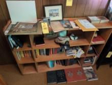 Bookshelf with assorted early hardback books, USN hatband decor