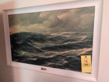 Group of framed artwork on wall