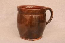 Mid-19th century redware mug with applied handle