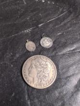 1883 Morgan Silver Dollar and Religious pendants