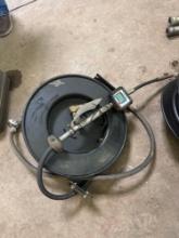Retractable hose with American Oil dispensing nozzle