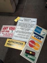 Group of modern shop signs, metal credit card sign, plastic towing private zone, authorized
