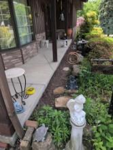 Large grouping of front porch outdoor decor and ornaments, bird bath, ducks, clay urn, Buddha and