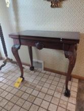 Modern tip top game table with claw feet