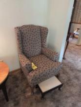 Upholstered wing back chair with stool
