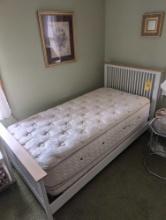 Twin size bed frame with clean mattress and box spring