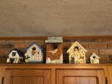 Assorted painted bird houses