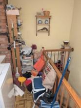 Contents of laundry room, stool, cooler, press wood shelves and laundry items