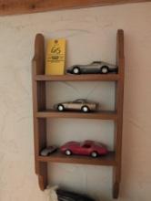 Shelf with assorted Corvette models