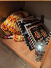 Contents of bottom of cabinets, tablecloths, quilt, records, cassettes, bar item's