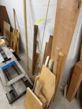 large assortment of wood, peg board,misc