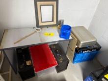 table, misc assortment of empty boxes and briefcases