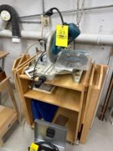 makita slide compound saw attached to nice work cabinet