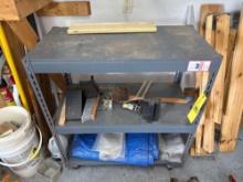 metal shelf with contents, brush, chalks