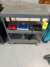 Rolling metal shop cart and batteries, scale