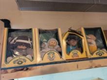 Group of 4 Cabbage patch dolls with original boxes