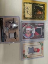 4 assorted sports cards