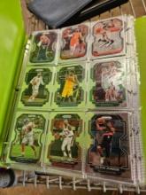 Binders with basketball cards and first day issue stamps
