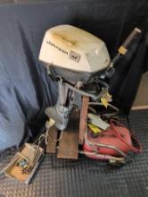Johnson 6 Hp outboard boat motor with tank, parts, cart and control