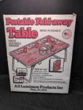 Portable fold away table