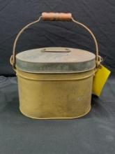 Antique metal lunch pail with trays and pierced bottom