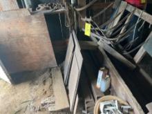 Contents of corner - Heavy metal pieces and a hay rake
