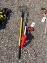 Pitch fork and an electric hedge trimmer