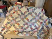 Large colorful handmade quilt by Mary Buchman