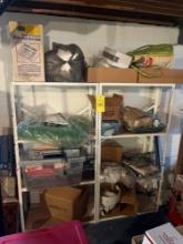 2 metal storage shelves with table cloths, stereo, lots of hangers
