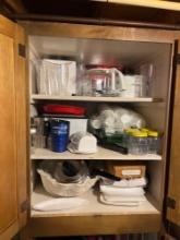 Contents of cabinet - blender, cups, cutting board, fridge organizers