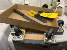 2 dolly carts, drill bits, machete, wire stripper