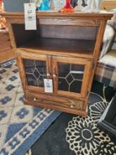 Oak stand with leaded doors