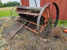 Early grain drill with steel wheels