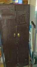 2 door metal storage cabinet with contents