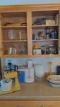 Contents of kitchen cupboards on stove side