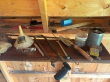 assorted hand tools, nails, motor oil, jack, funnel, hook, caulking gun