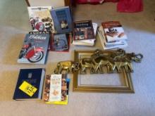 assorted books including motorcycle, wood working, self help books, frame piece, wlephant walldecor
