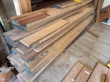 large lot of assorted lumber bottom shelf