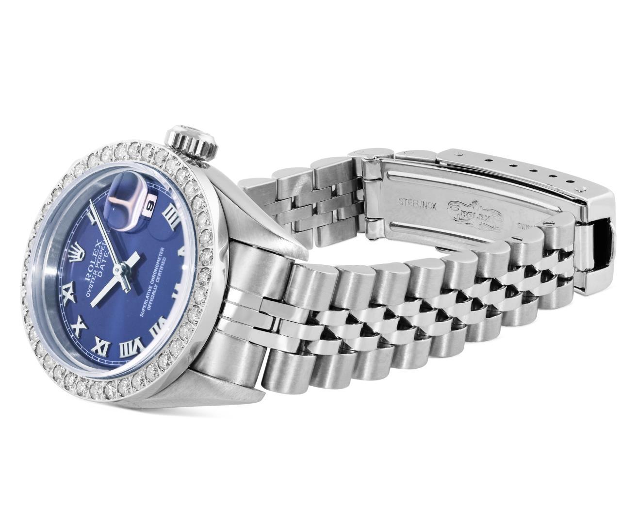 Rolex Ladies Stainless Steel Quickset Blue Roman Diamond Bezel Date Wristwatch