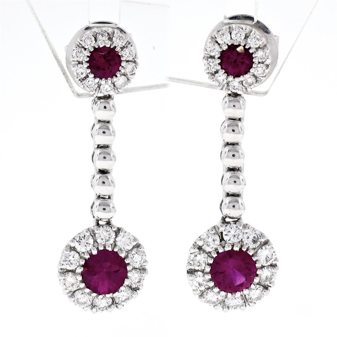 Fancy 18K White Gold 1.38 ctw Round Ruby w/ Diamond Halo Post Drop Dangle Earrin