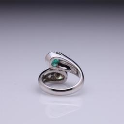 18k White Gold Moissanite & Emerald Crossover Ring by Carlo Rici