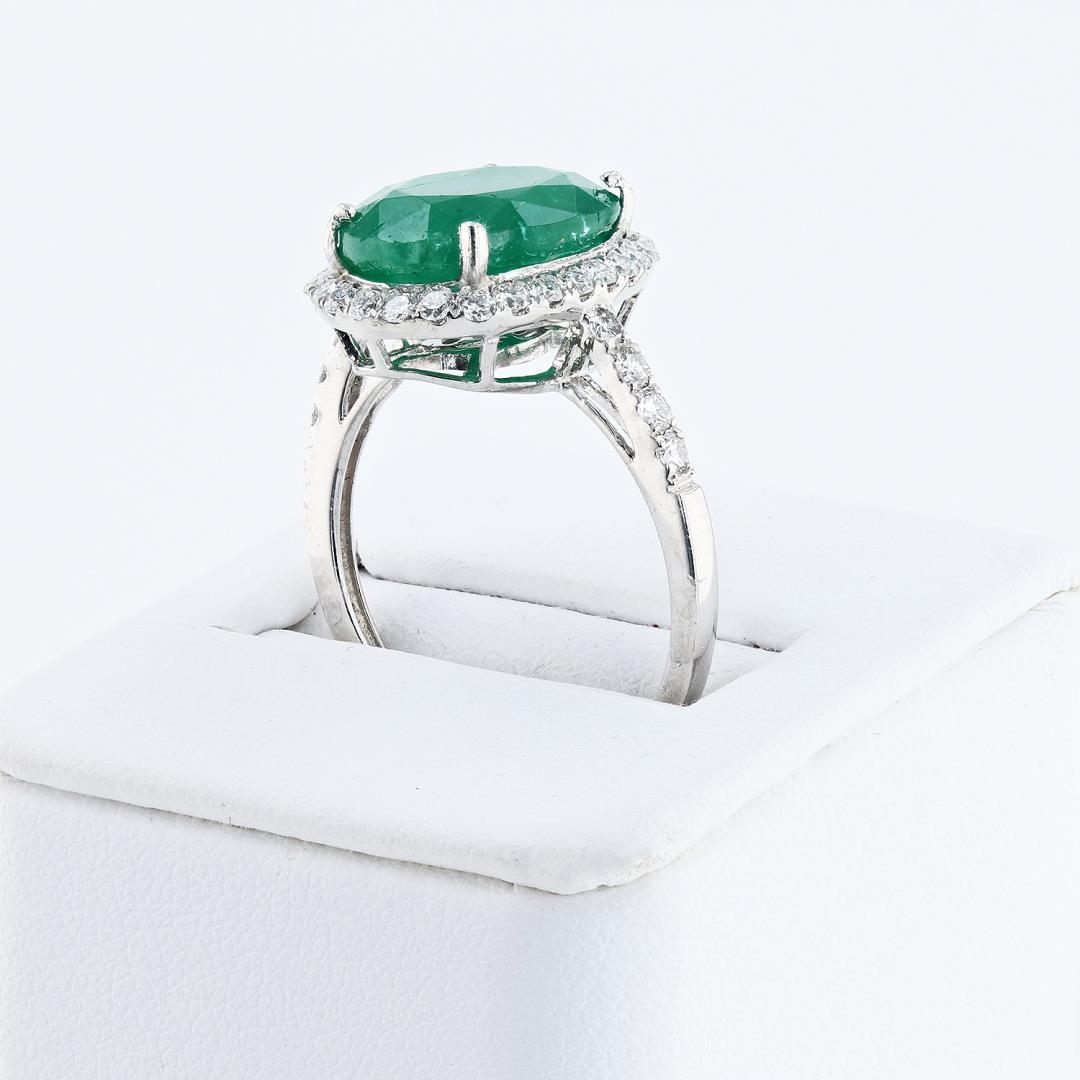 5.99 ctw Emerald and 0.68 ctw Diamond Platinum Ring