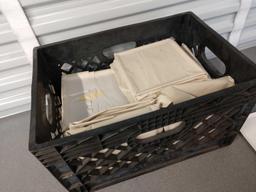 Crate full of dinner plates