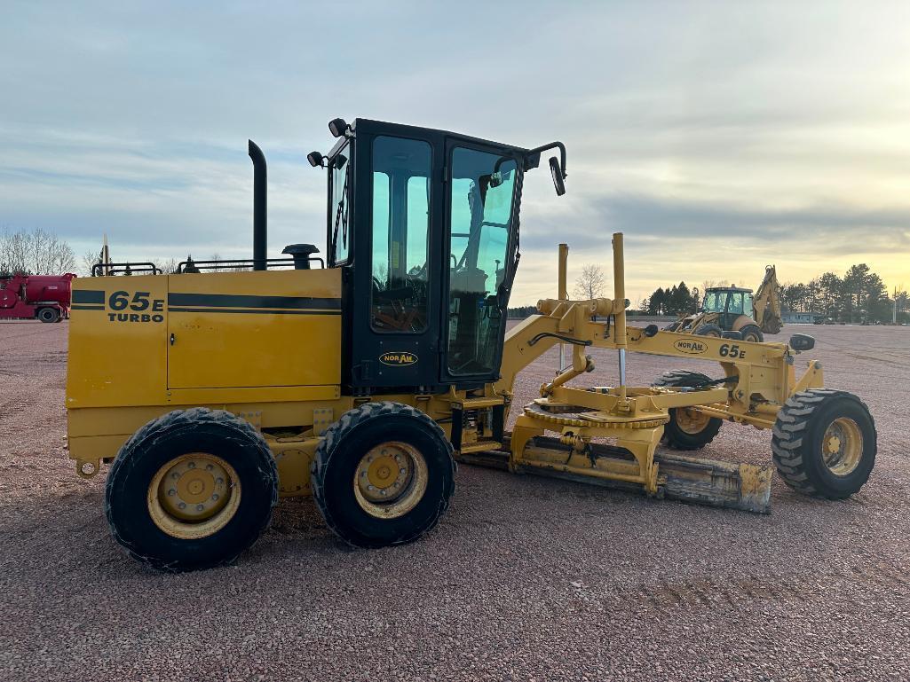 2010 Noram 65E motor grader, cab w/AC, 4 wheel drive, Cat diesel engine, 15-19.5 tires, powershift