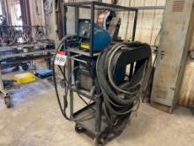 Miller XMT 450 CC/CV welder w/ Miller 75 Series 24 volt wire feeder; 50 ft feeder extension & cart.
