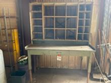 Metal shop table with top storage.