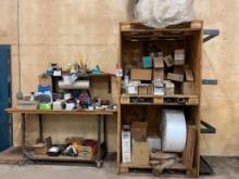 Shipping center w/ table on casters, shelving and related items.