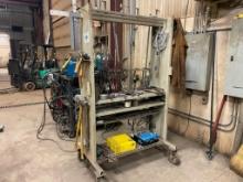 Steel welding tool rack on casters; no contents.