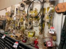 Assortment of hardware on peg board.