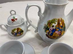 Small tea set - broken handle on smaller pitcher